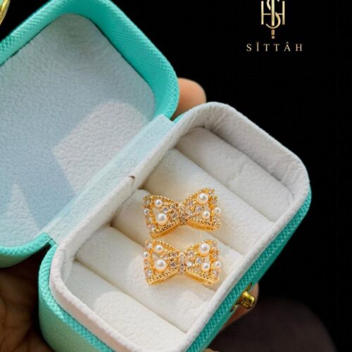 Mini Pearl and Diamond Bow Stud Earrings.