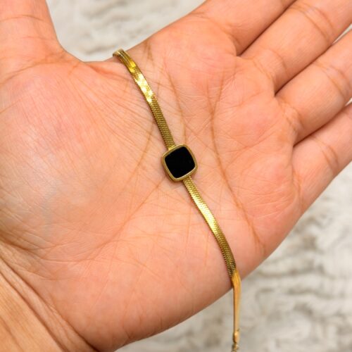 Gold-Plated Herringbone (or Snake) Chain Bracelet with a Black Square Onyx Pendant.