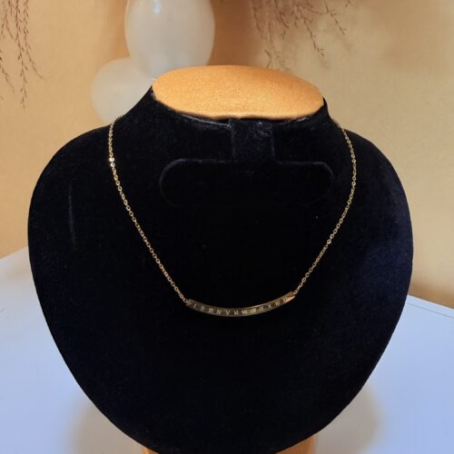 Gold Roman Numeral Curved Bar Necklace.